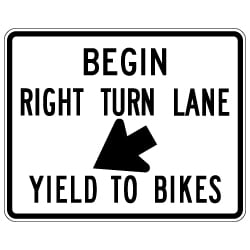 R4-4 Begin Right Turn Lane Yield to Bikes Sign - 30x24. Made with High Intensity Prismatic (HIP) Reflective Sheeting and Rust-Free Heavy Gauge Aluminum from STOPSignsAndMore.com